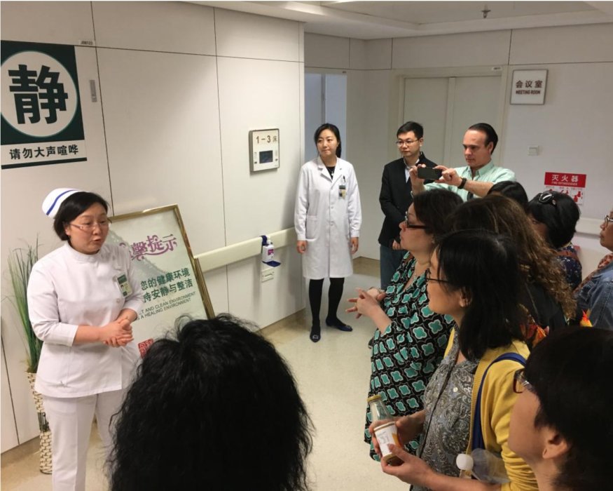 A nurse in a hospital hallway to visiting nurses