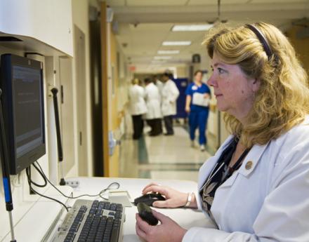 Electronic Medical Records Nurse Looking at Computer